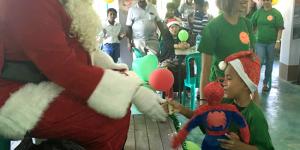 Santa gives a stuff for “one stuffed animal toy per orphaned child” program on Christmas
