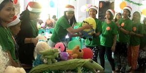 Giving stuffs to children for “one stuffed animal toy per orphaned child” program on Christmas